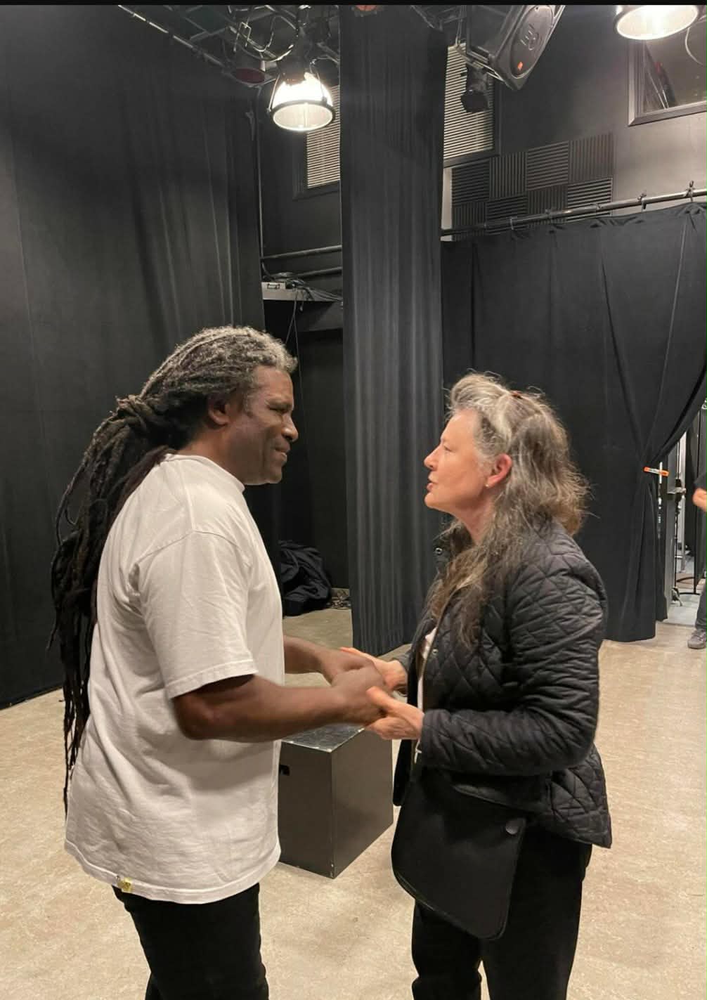 Anthony Michael Jefferson speaking with a guest backstage
